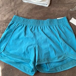 Women workout shorts. Color is more Teal.